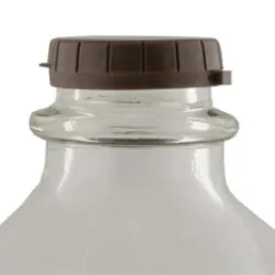 Brown lid on a glass milk jug